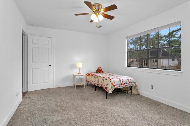 8014 Northbridge Cir, Spring, TX 77379 - carpeted bedroom featuring baseboards and a ceiling fan