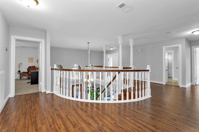 8014 Northbridge Cir, Spring, TX 77379 - corridor with wood finished floors, an upstairs landing, baseboards, and a textured ceiling