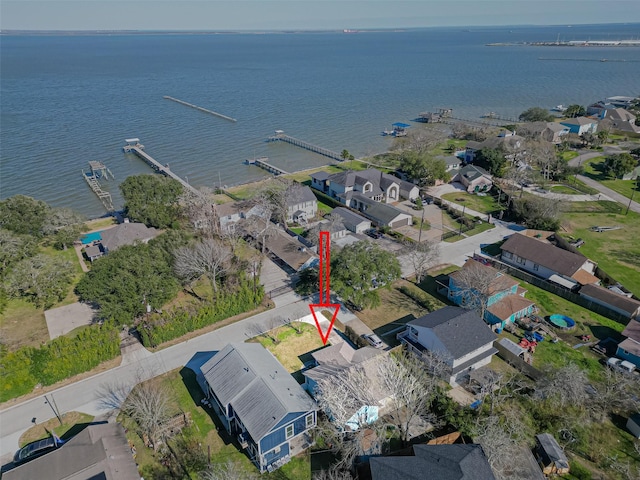 bird's eye view featuring a residential view and a water view