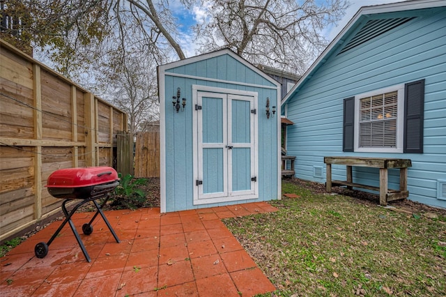 view of shed featuring a fenced backyard