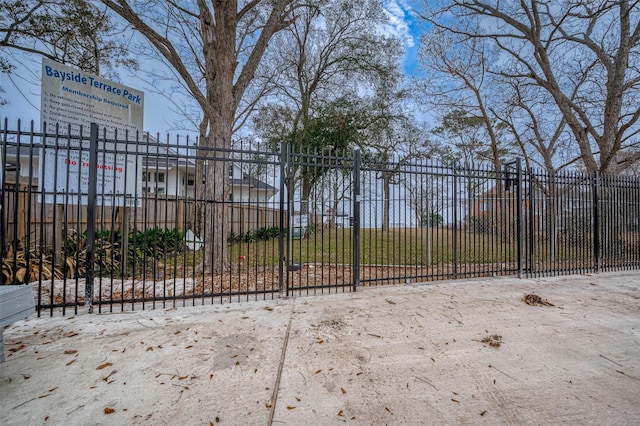 view of gate featuring fence