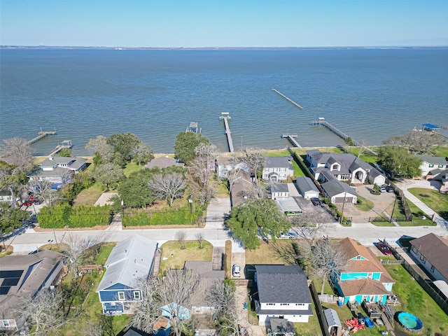 bird's eye view featuring a residential view and a water view