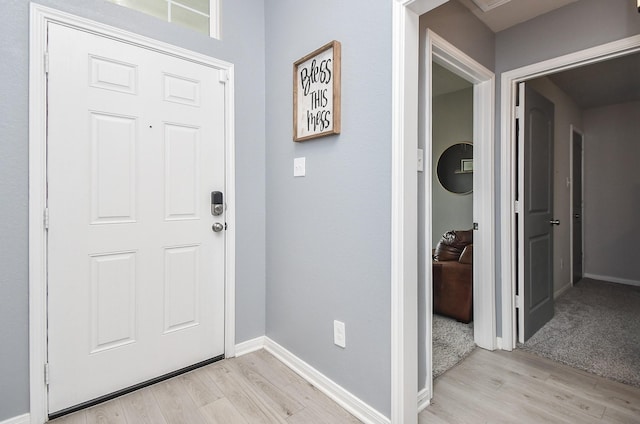 915 Acorn Trail Pl, Tomball, TX 77375 - foyer featuring light wood-type flooring and baseboards