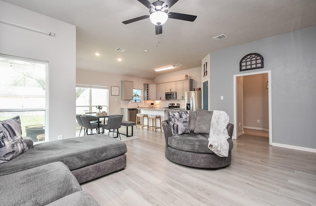 915 Acorn Trail Pl, Tomball, TX 77375 - living room featuring light wood-style floors, ceiling fan, baseboards, and recessed lighting