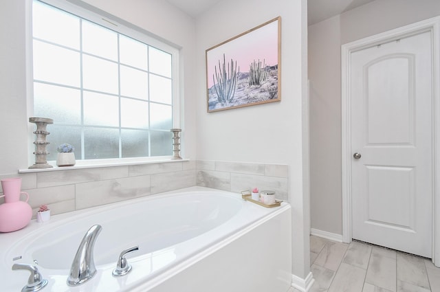 915 Acorn Trail Pl, Tomball, TX 77375 - full bathroom featuring a bath and marble finish floors