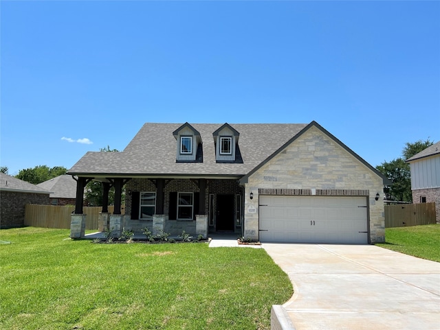 view of front of property featuring concrete driveway, roof with shingles, an attached garage, fence, and a front lawn