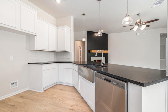 1414 Rd 66113, Dayton, TX 77535 - kitchen featuring stainless steel dishwasher, light wood-type flooring, a ceiling fan, a peninsula, and open floor plan