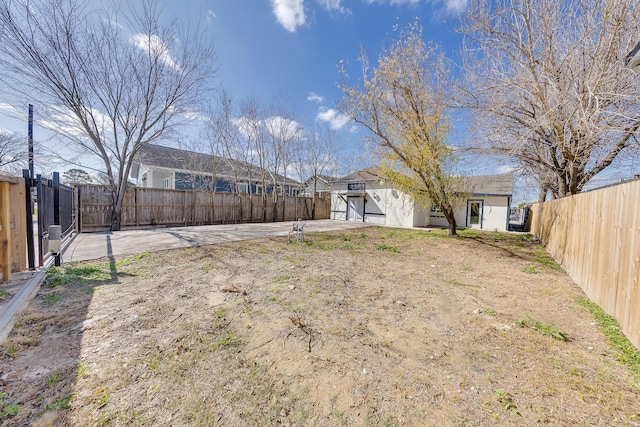 view of yard with a patio area and a fenced backyard