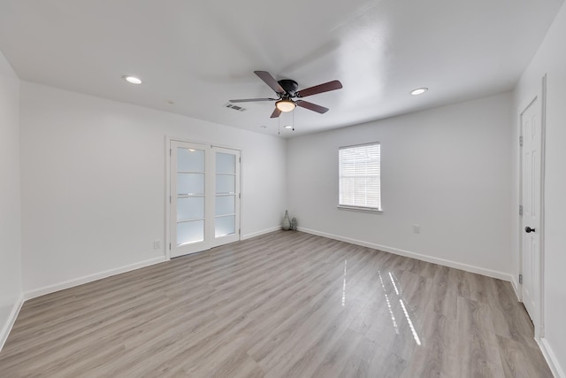 spare room with recessed lighting, baseboards, visible vents, and light wood-type flooring