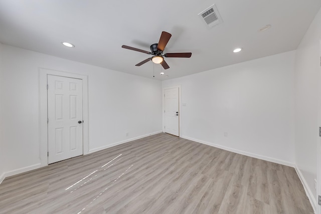 empty room with visible vents, baseboards, recessed lighting, light wood-style flooring, and a ceiling fan