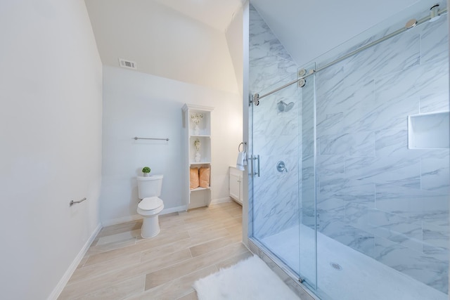 bathroom with a marble finish shower, toilet, visible vents, and wood tiled floor