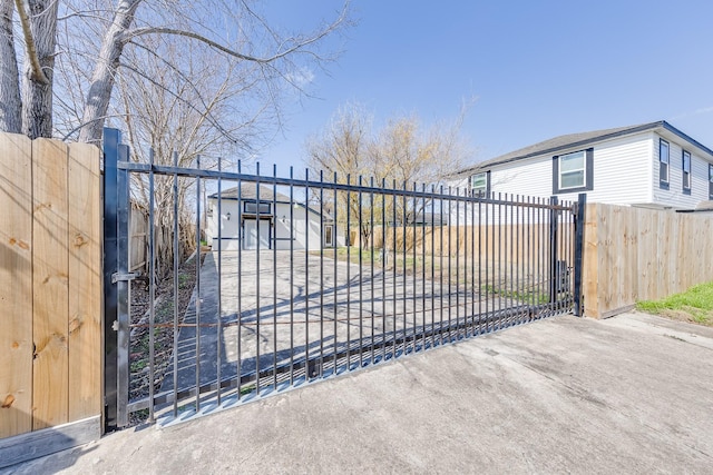 view of gate featuring a fenced front yard