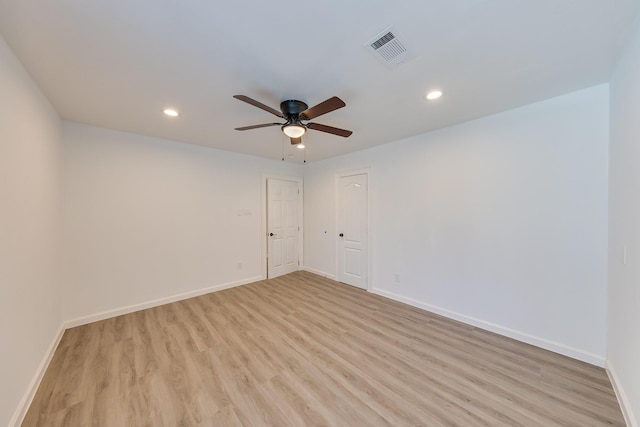 empty room with recessed lighting, visible vents, light wood-style flooring, ceiling fan, and baseboards