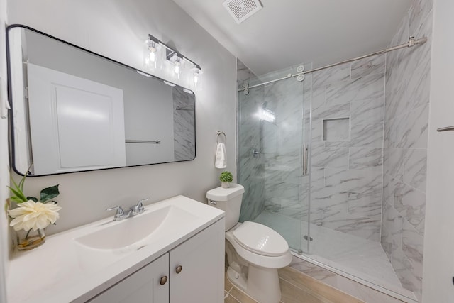 full bathroom with vanity, toilet, visible vents, and a marble finish shower