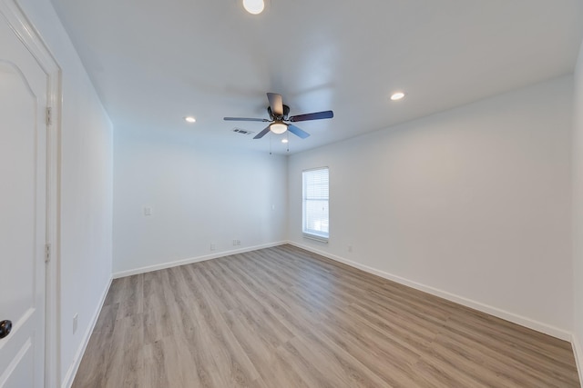 unfurnished room with a ceiling fan, visible vents, baseboards, recessed lighting, and light wood-style floors