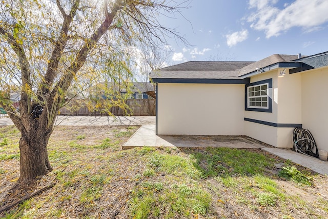 view of yard featuring a patio and fence