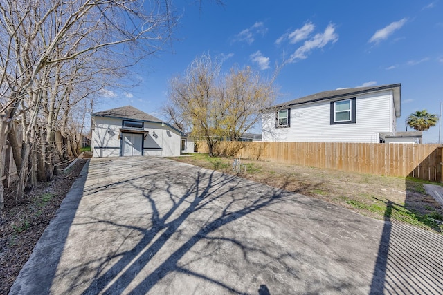 view of home's exterior featuring fence