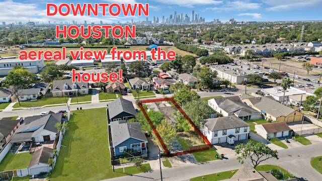 aerial view featuring a view of city and a residential view