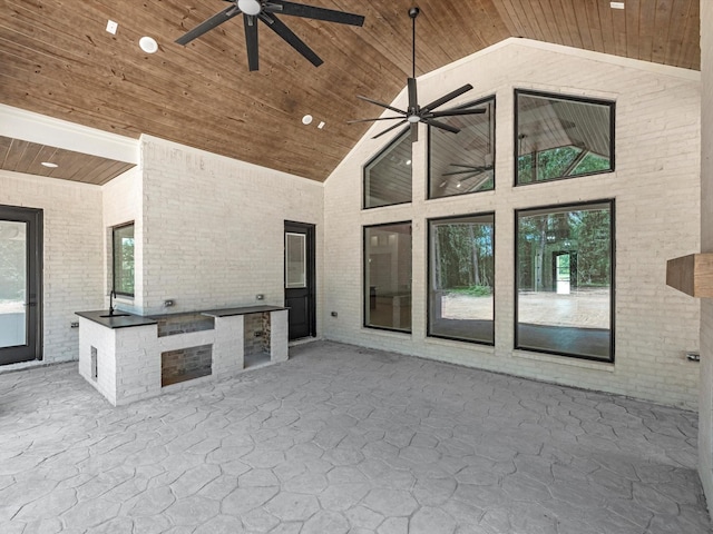 view of patio / terrace featuring an outdoor kitchen and a ceiling fan