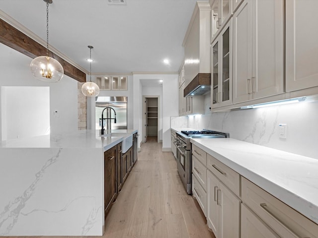 15681 Connie Ln, Montgomery, TX 77316 - kitchen featuring tasteful backsplash, hanging light fixtures, high quality appliances, and glass insert cabinets