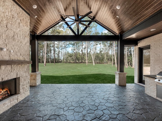 15681 Connie Ln, Montgomery, TX 77316 - view of patio / terrace featuring a gazebo, an outdoor kitchen, an outdoor stone fireplace, and ceiling fan