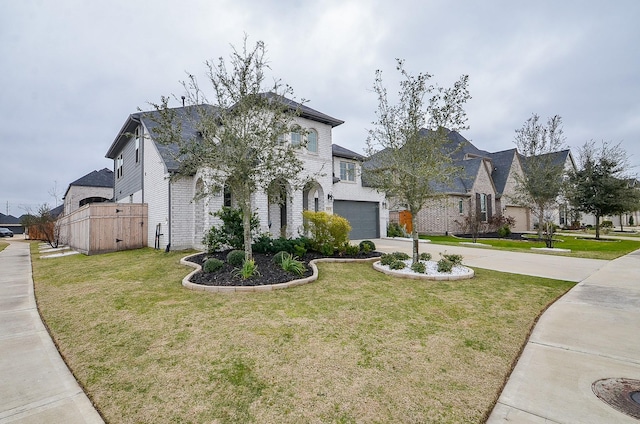 french country inspired facade featuring driveway, a residential view, and a front yard