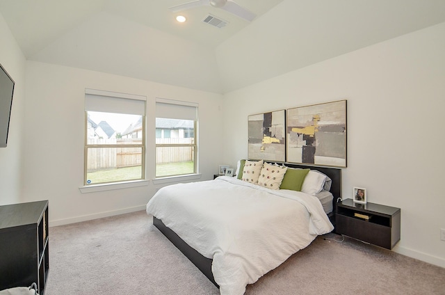 carpeted bedroom with vaulted ceiling, visible vents, and baseboards