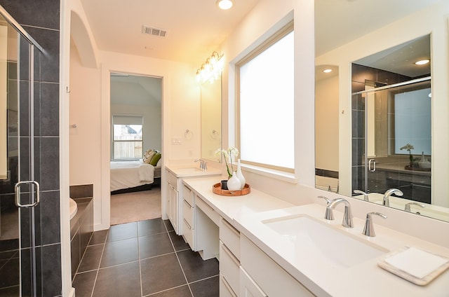 full bathroom featuring ensuite bath, tile patterned flooring, visible vents, and a sink