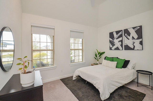 bedroom featuring carpet and baseboards