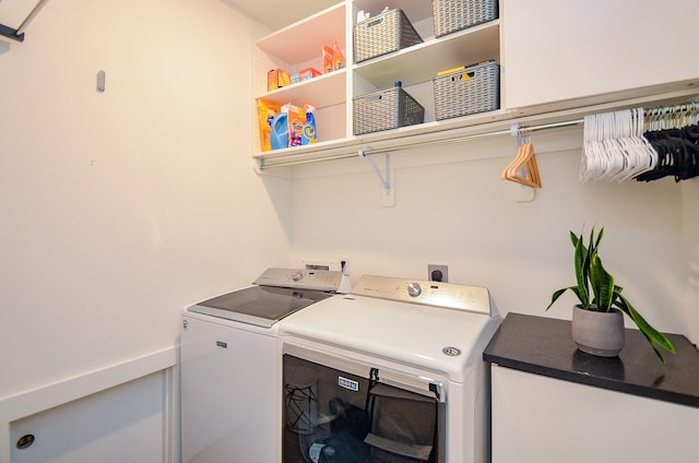 laundry room with laundry area and washing machine and clothes dryer