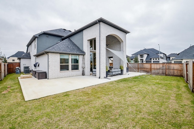 back of property featuring central air condition unit, a patio area, outdoor lounge area, and brick siding