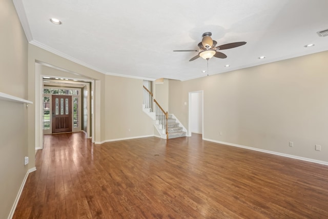 unfurnished living room featuring stairway, baseboards, wood finished floors, and a ceiling fan