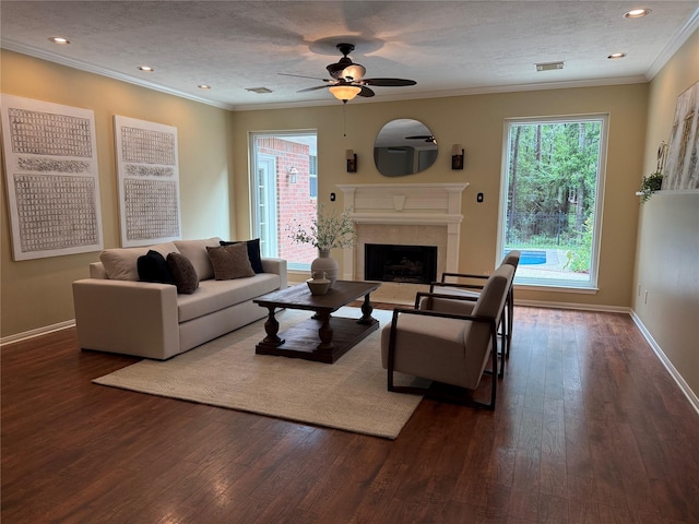 19 Shady Pond Pl, The Woodlands, TX 77382 - living room with dark wood-style floors, ceiling fan, a fireplace, baseboards, and ornamental molding