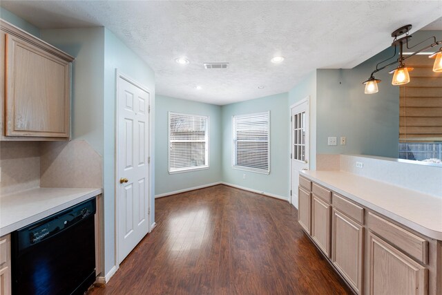 kitchen with visible vents, dark wood-style flooring, light brown cabinetry, a textured ceiling, and dishwasher