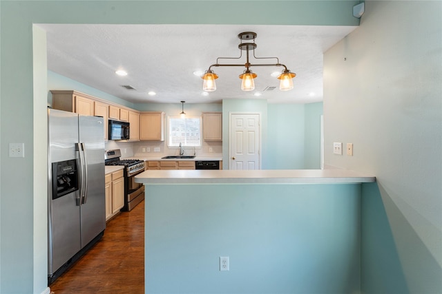 kitchen with black appliances, light brown cabinetry, a sink, a peninsula, and light countertops