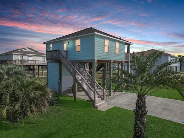 exterior space featuring stairs and a lawn