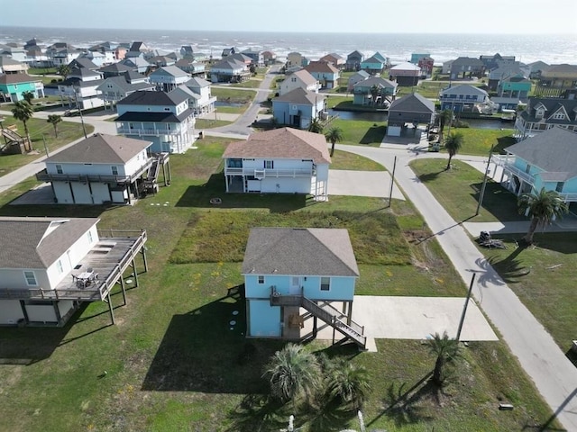 birds eye view of property featuring a water view and a residential view
