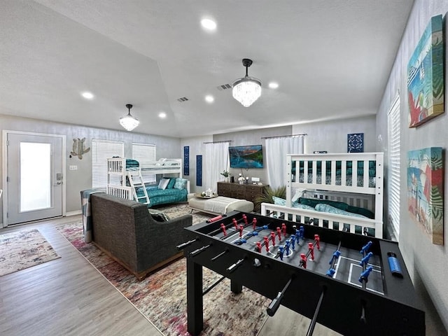 game room featuring light wood-style flooring, visible vents, and recessed lighting