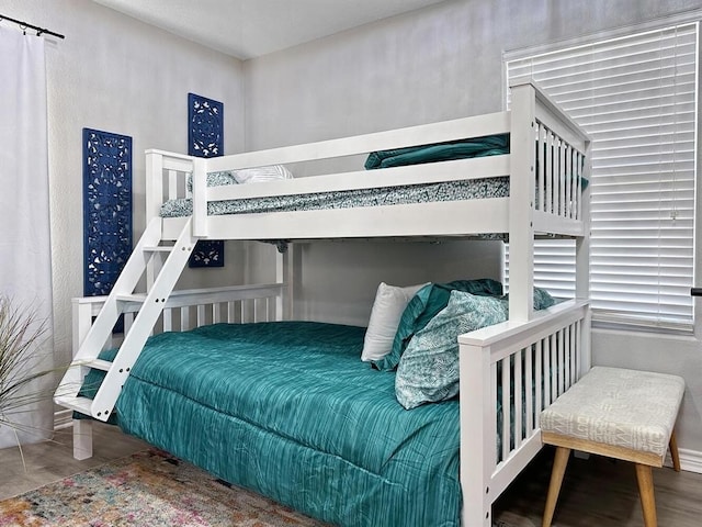 bedroom featuring wood finished floors