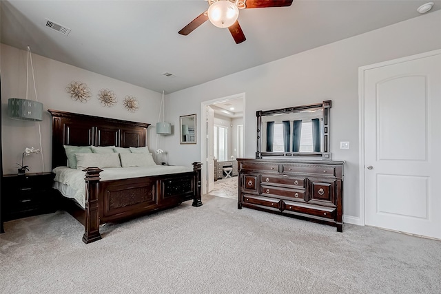 bedroom with ceiling fan, visible vents, and light colored carpet