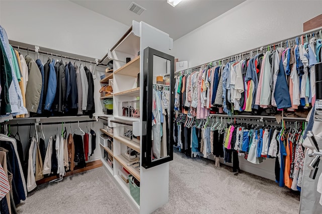 spacious closet featuring light carpet and visible vents