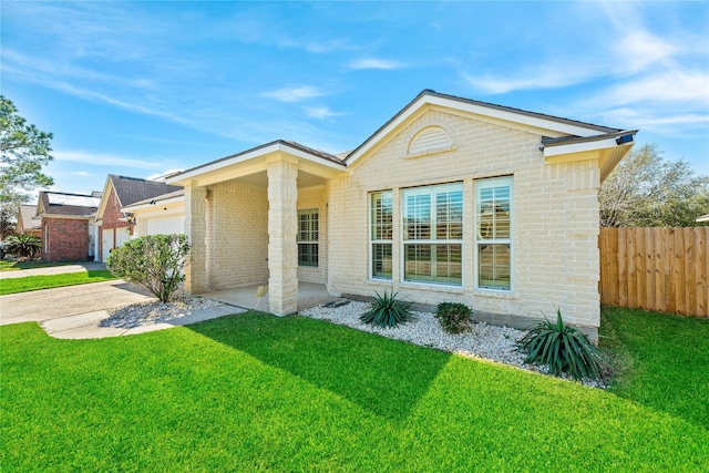 view of front of property featuring a garage, concrete driveway, fence, a front lawn, and brick siding