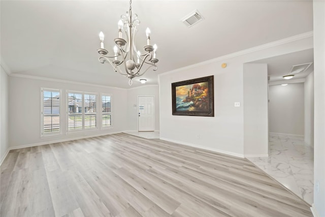 spare room with light wood finished floors, baseboards, visible vents, and crown molding