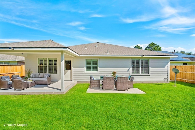 rear view of house with a patio, fence, and an outdoor hangout area