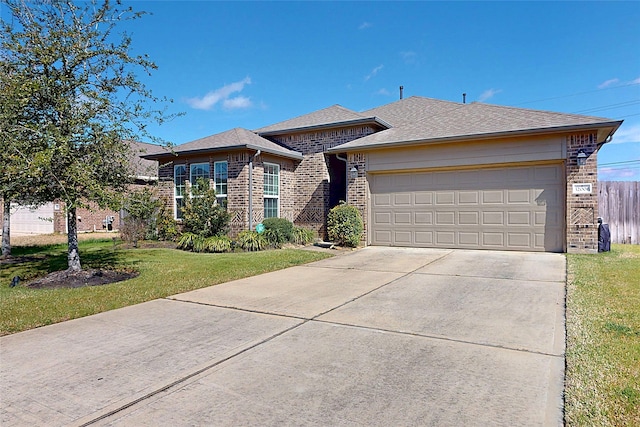 view of front of house with a garage, a front lawn, concrete driveway, and brick siding