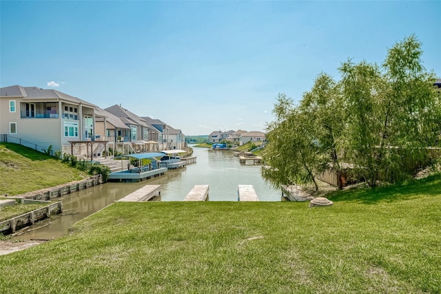 water view with a dock and a residential view