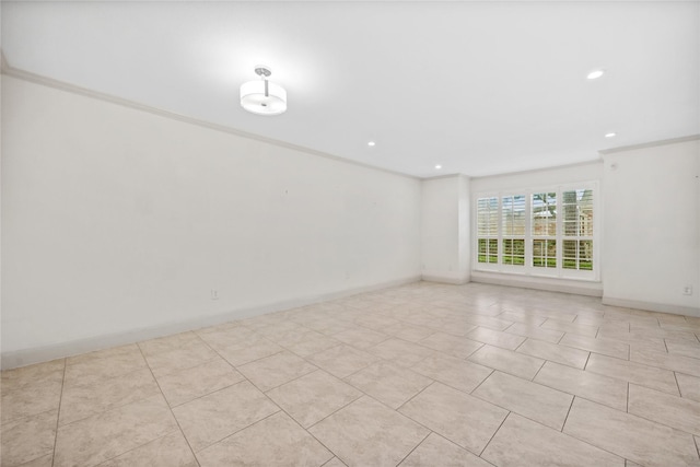 empty room with ornamental molding, recessed lighting, and baseboards