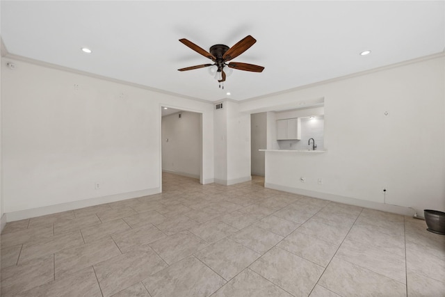 spare room featuring baseboards, visible vents, ceiling fan, a sink, and recessed lighting