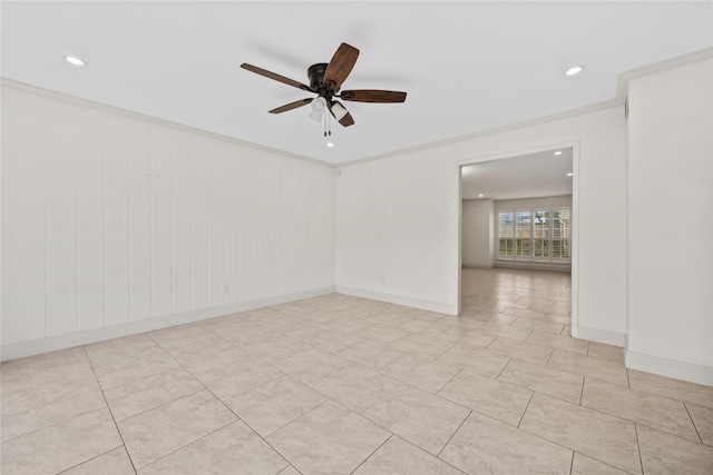 empty room featuring a ceiling fan, recessed lighting, crown molding, and baseboards