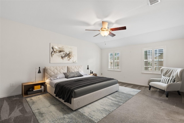 carpeted bedroom with vaulted ceiling, ceiling fan, visible vents, and baseboards